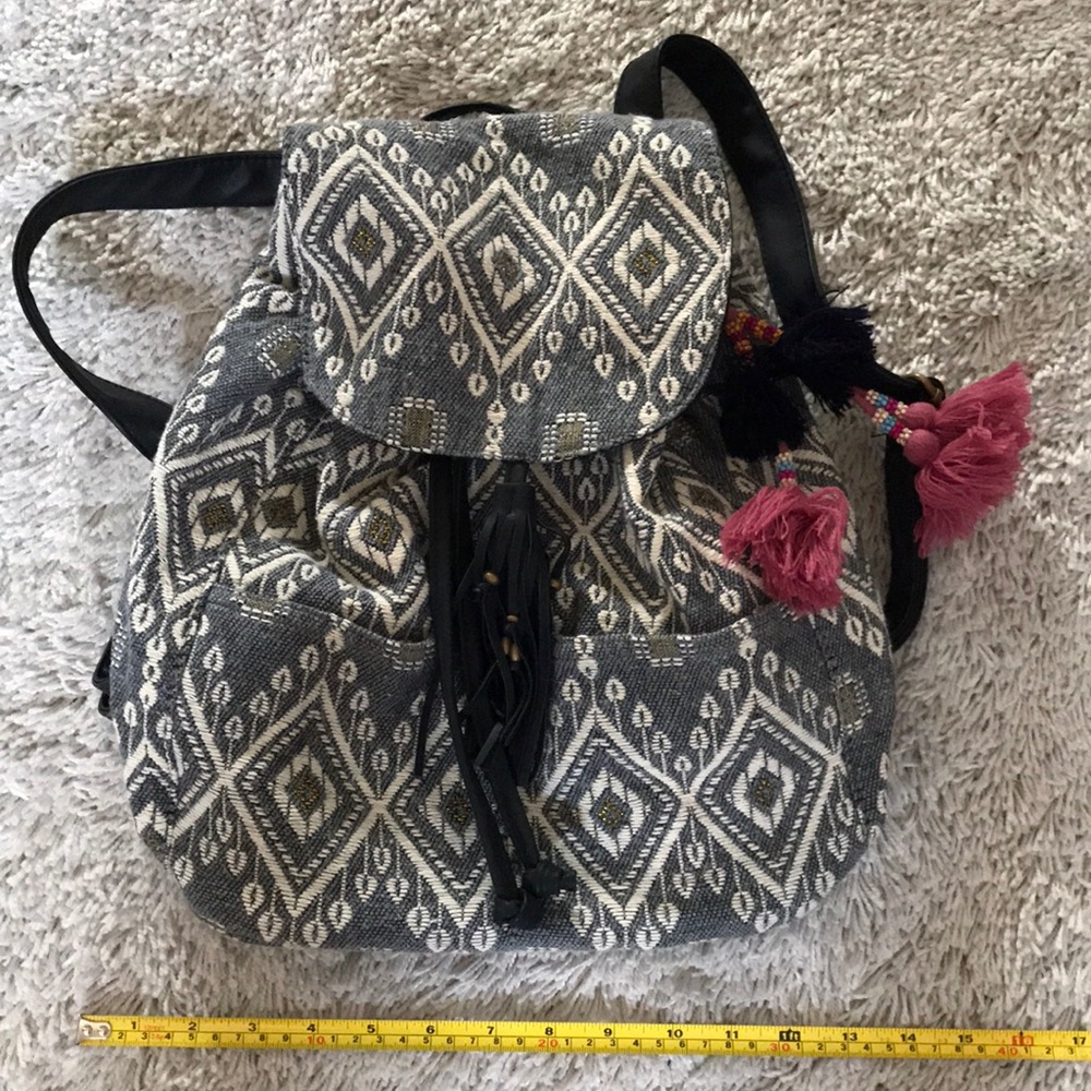 Hobo backpack with outside slip pockets